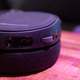 Volume control and a mute button are both on the headset itself. The mute button sticks up when engaged.
